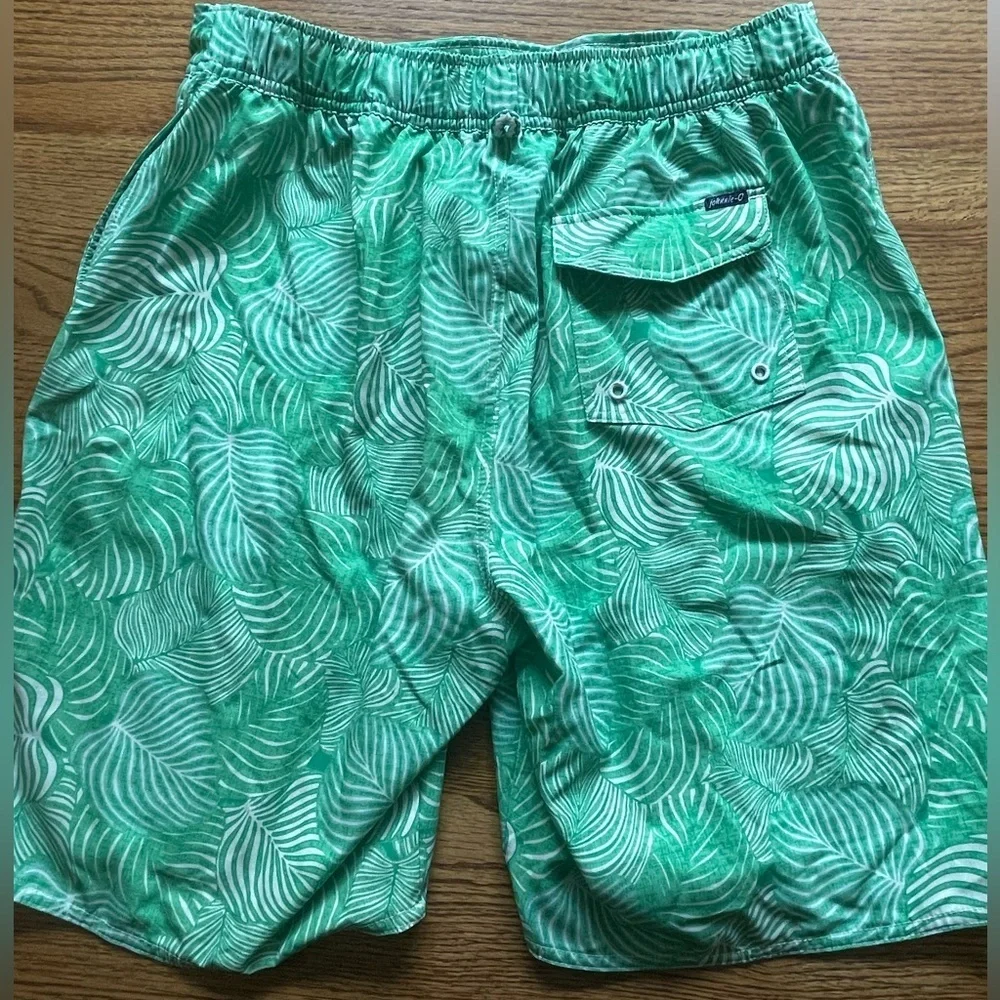 Johnnie-O swim shorts- green leaf design- size men’s large elastic in back.